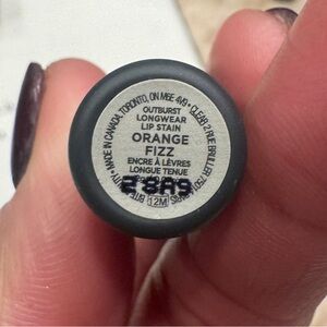 Bite Lip Stain in Orange Fizz. Never used, only swatched.